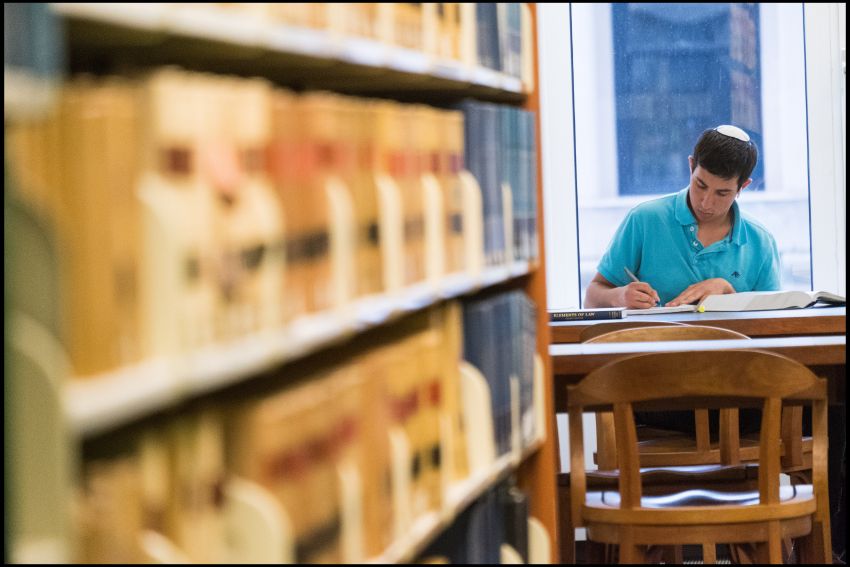 student studying in library